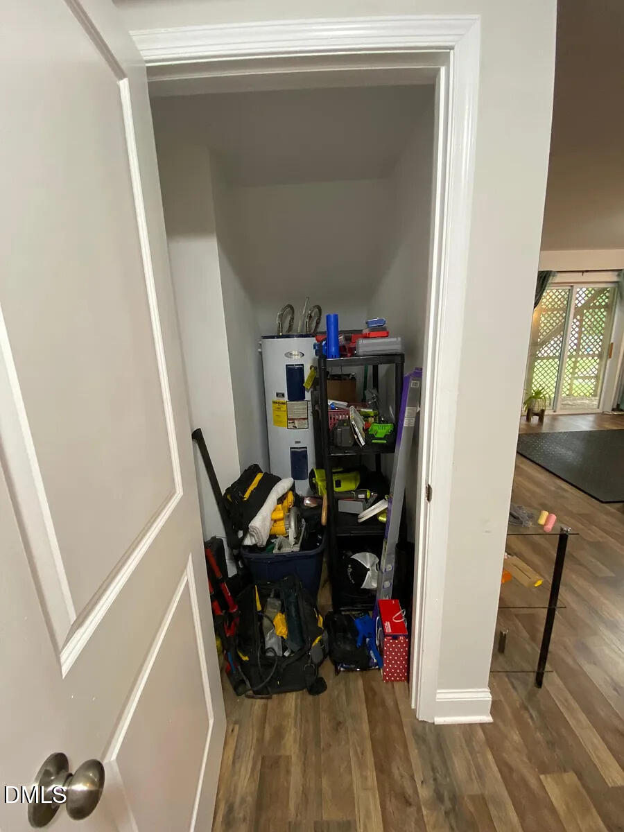7501 Post Oak Road Raleigh, NC 27615 - Photo 38 of 40 a view of walk in closet with clothes and shoes