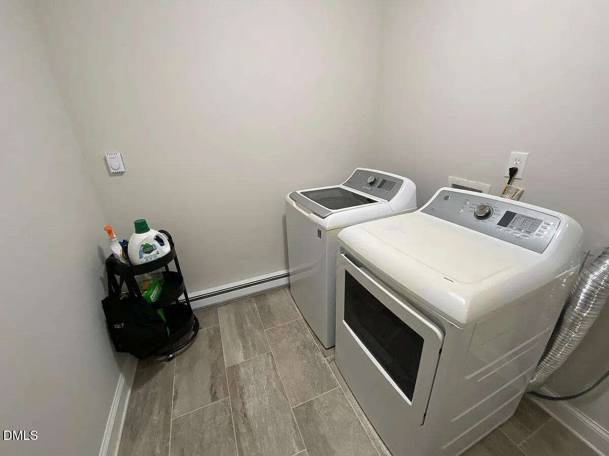 7501 Post Oak Road Raleigh, NC 27615 - Photo 39 of 40 a utility room with dryer and washer