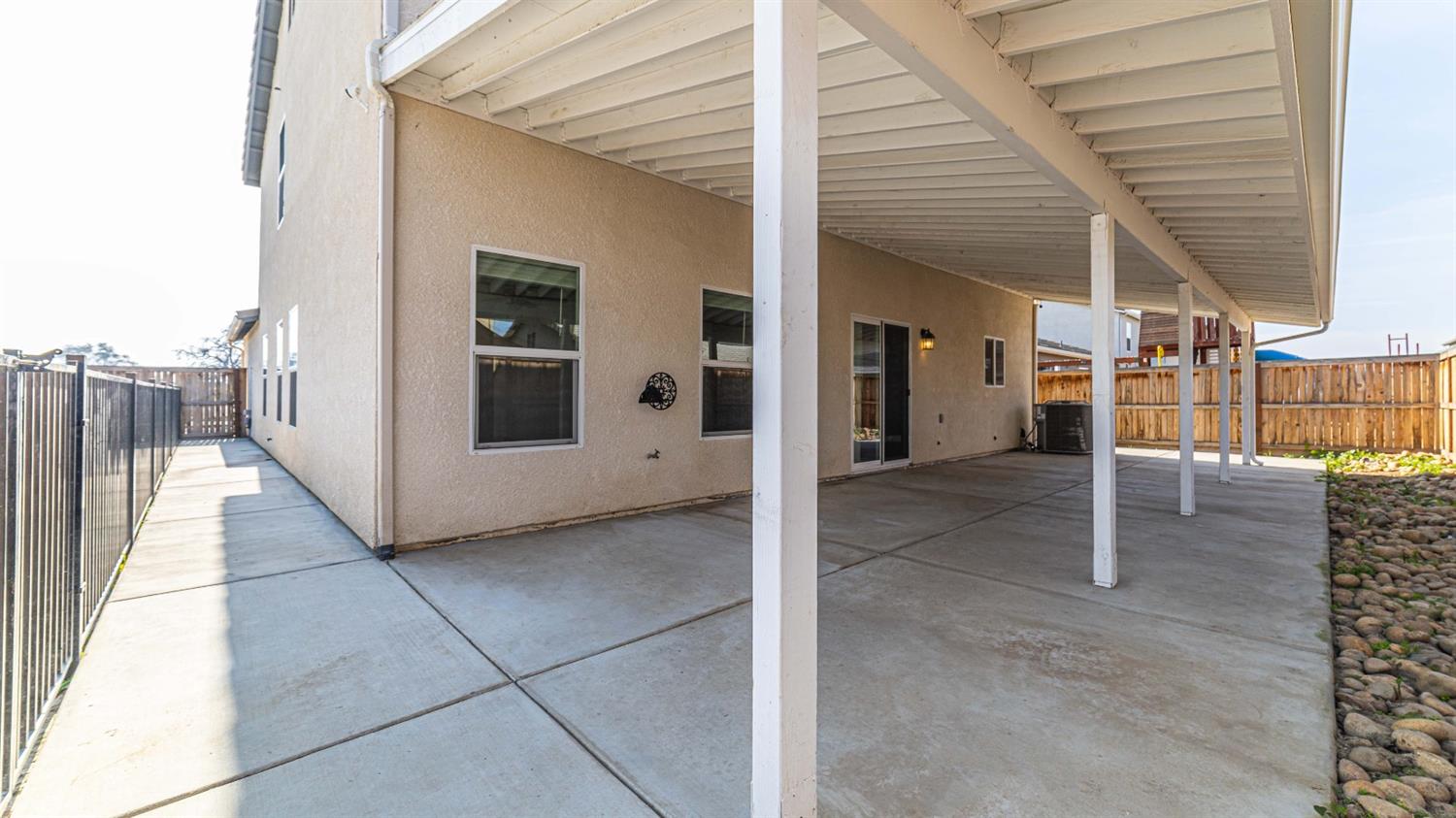 512 Barbara Avenue Sanger, CA 93657 - Photo 11 of 40 a view of a house with a door and wooden fence