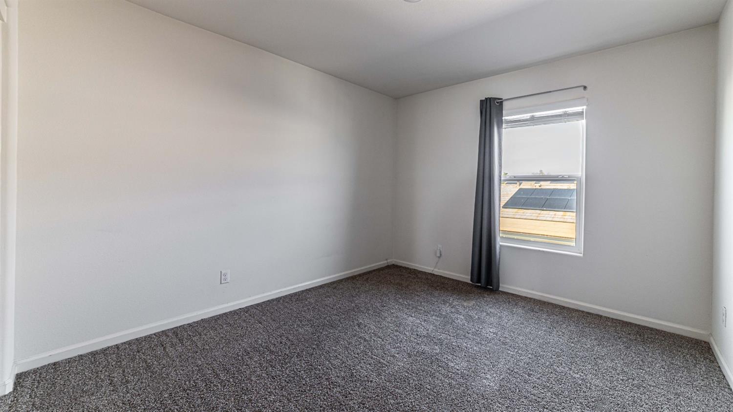 512 Barbara Avenue Sanger, CA 93657 - Photo 27 of 40 a view of an empty room and window