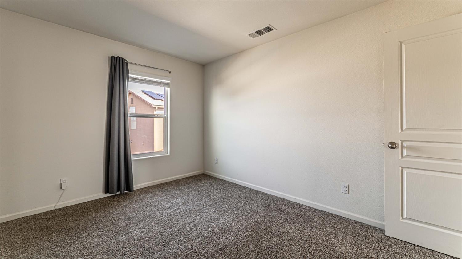 512 Barbara Avenue Sanger, CA 93657 - Photo 29 of 40 a view of an empty room with a window