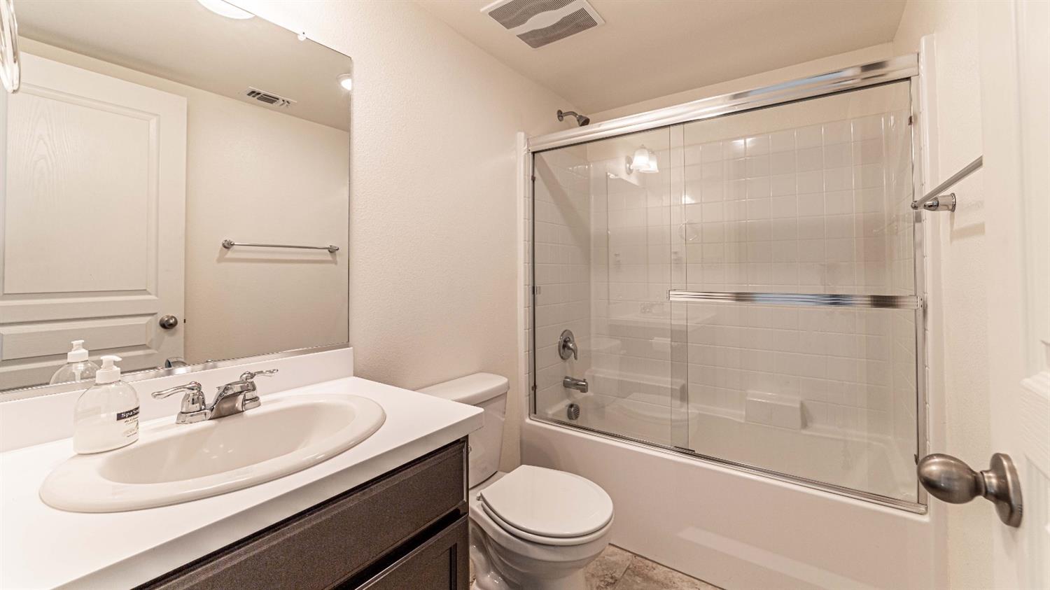 512 Barbara Avenue Sanger, CA 93657 - Photo 34 of 40 a bathroom with a sink toilet and shower