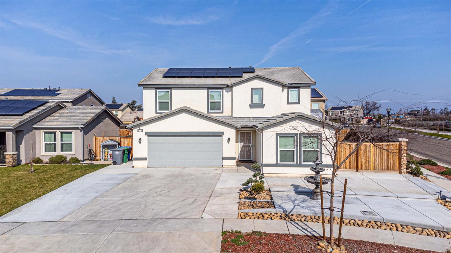 512 Barbara Avenue Sanger, CA 93657 - Photo 9 of 40 a front view of a house with a yard