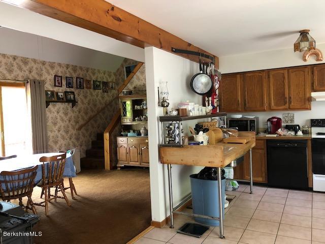 2153 Hancock Road Hancock, MA 01267 - Photo 3 of 24 a kitchen with a table and chairs in it