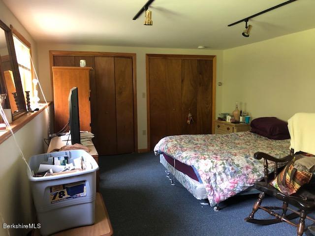 2153 Hancock Road Hancock, MA 01267 - Photo 10 of 24 a bedroom with a bed and a table in it