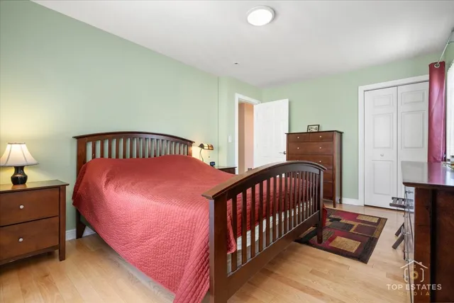 a bedroom with bed and a window