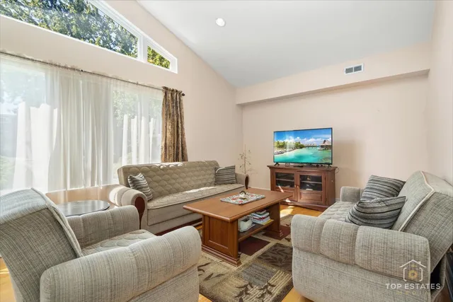 a living room with furniture and a window