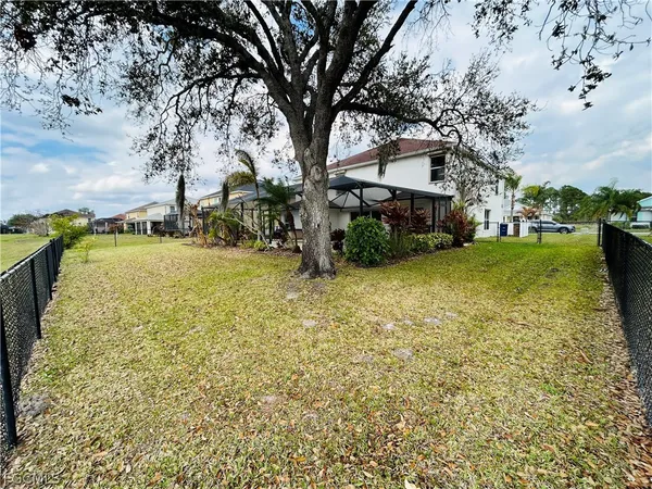 a view of empty room with a fireplace