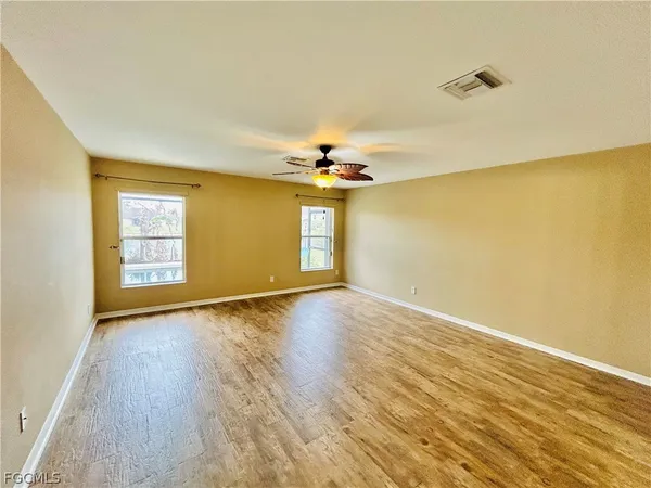 a view of kitchen with wooden floor