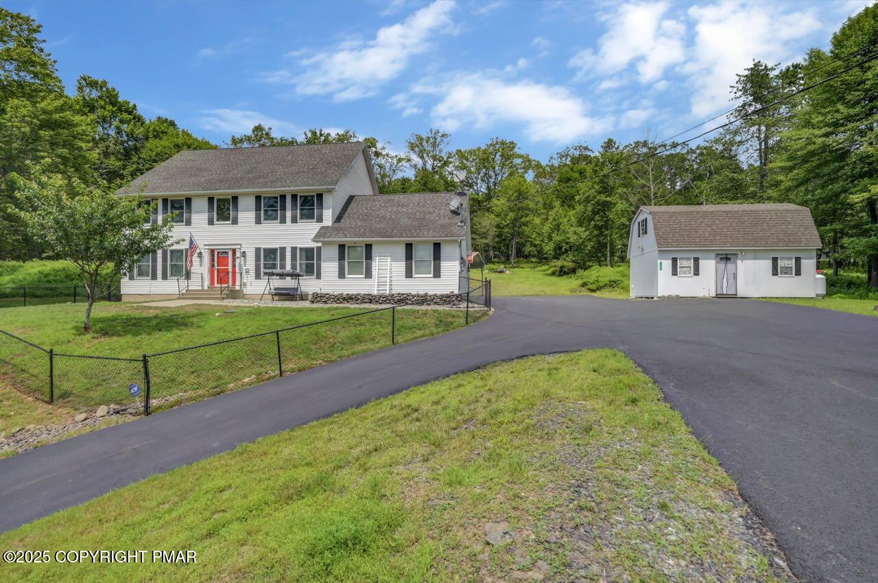 a view of a house with a yard