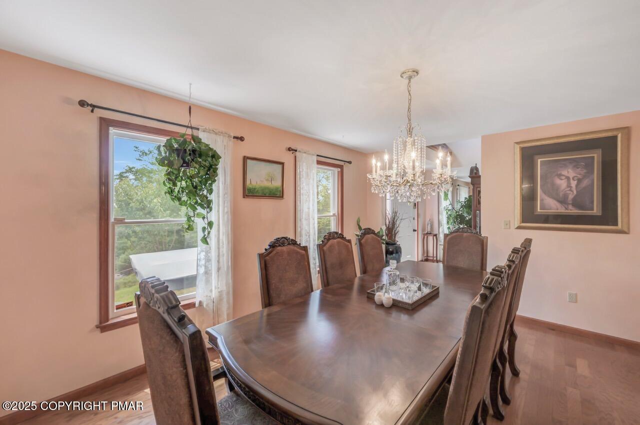 649 Snow Hill Road Cresco, PA 18326 - Photo 12 of 31 a view of a dining room with furniture window and outside view