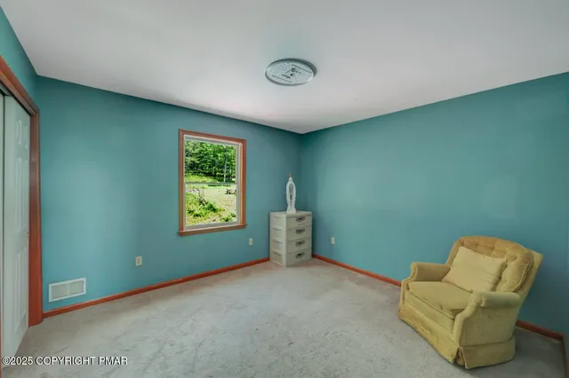 a view of livingroom with furniture and windows