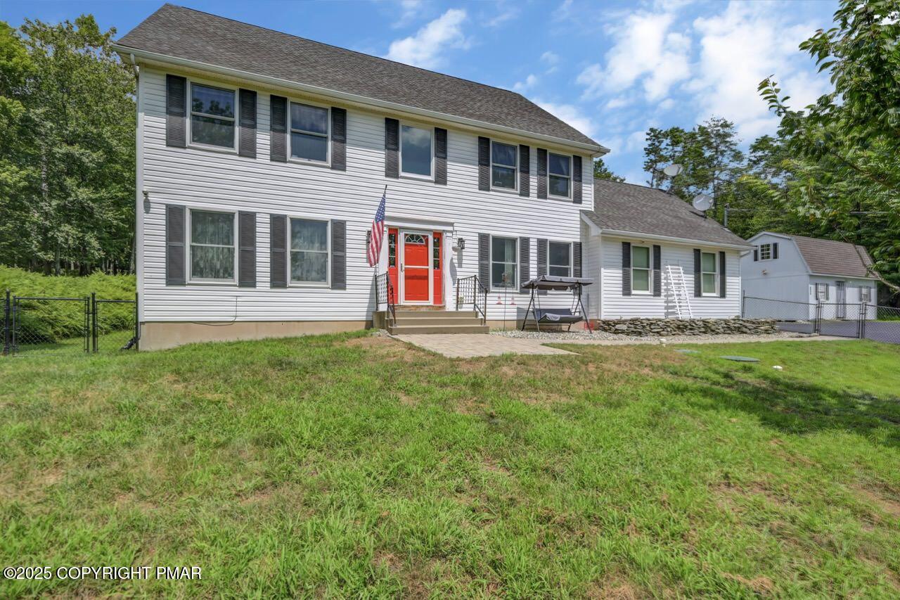 649 Snow Hill Road Cresco, PA 18326 - Photo 2 of 31 a front view of a house with a yard