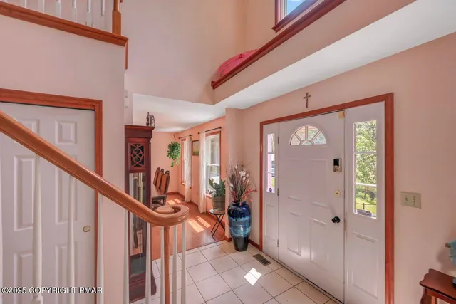 a view of an entryway with a front door