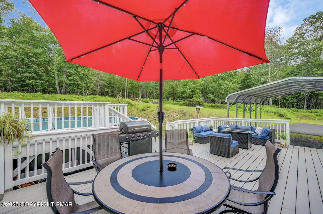 649 Snow Hill Road Cresco, PA 18326 - Photo 22 of 31 a view of a chair and table in the patio with a swimming pool