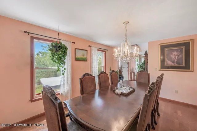 a view of a dining room with furniture window and outside view