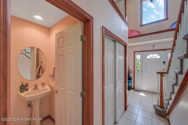 a bathroom with a sink a mirror and a shower