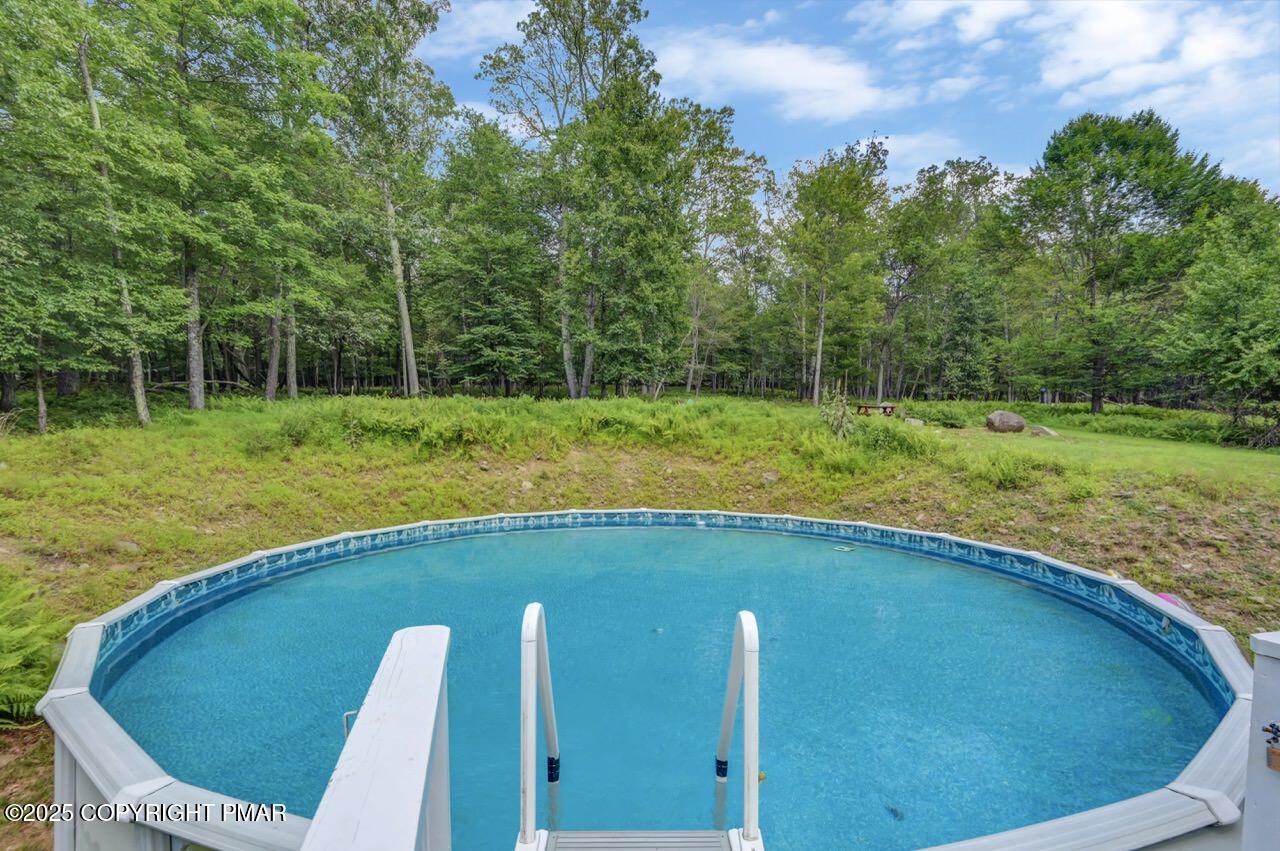 649 Snow Hill Road Cresco, PA 18326 - Photo 25 of 31 a view of a backyard with swimming pool