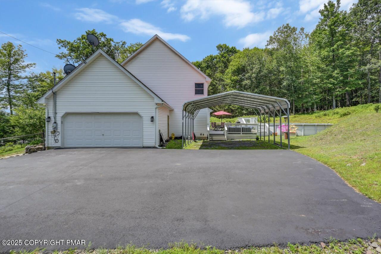 649 Snow Hill Road Cresco, PA 18326 - Photo 27 of 31 a view of a house with backyard and garden