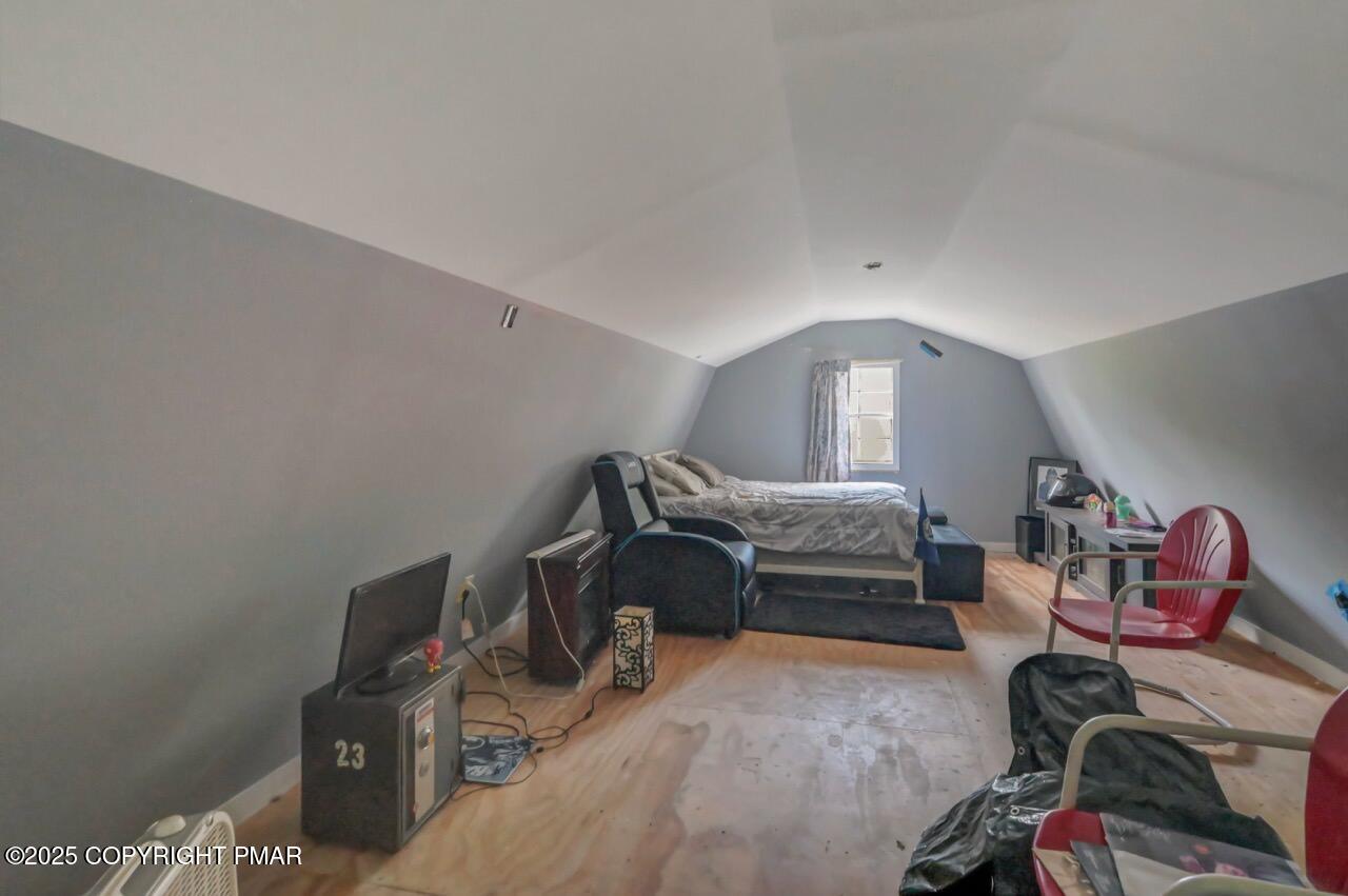 649 Snow Hill Road Cresco, PA 18326 - Photo 30 of 31 a bedroom with furniture and a window