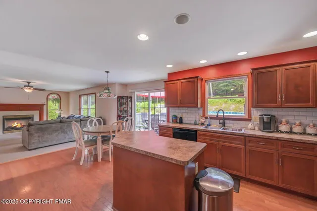 a large kitchen with a table and chairs
