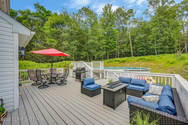 an outdoor space with furniture and umbrella