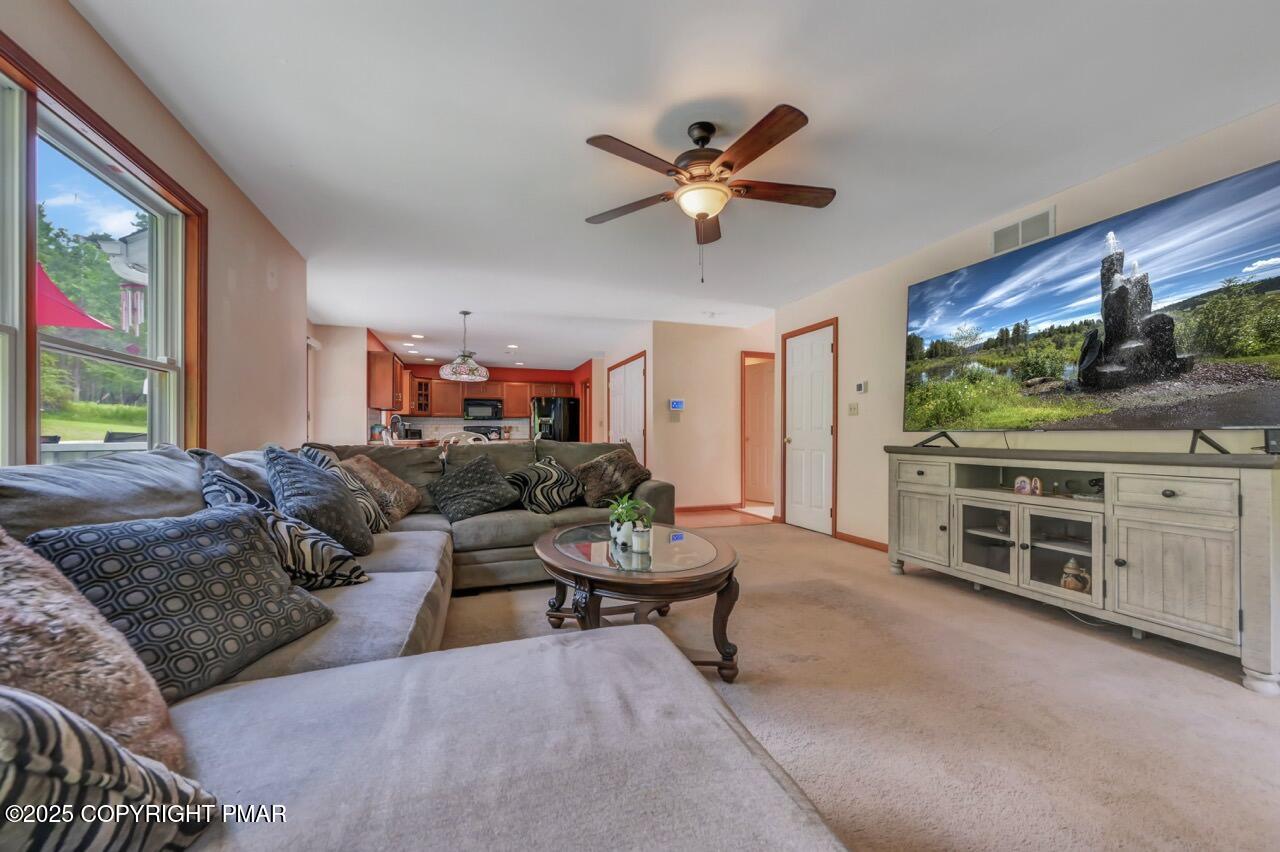 649 Snow Hill Road Cresco, PA 18326 - Photo 6 of 31 a living room with furniture and a flat screen tv