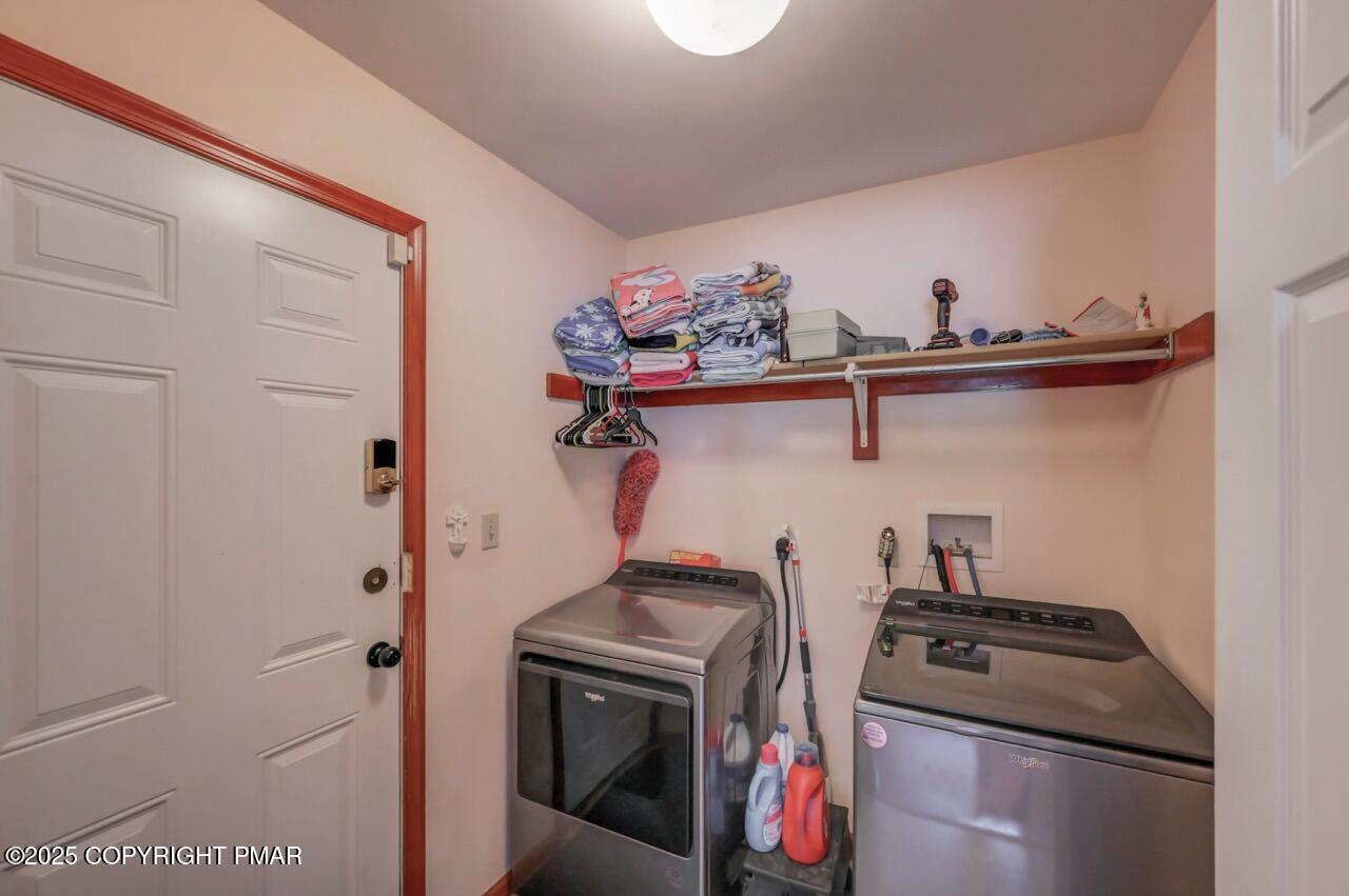 649 Snow Hill Road Cresco, PA 18326 - Photo 10 of 31 a close view of a utility room with dryer and washer