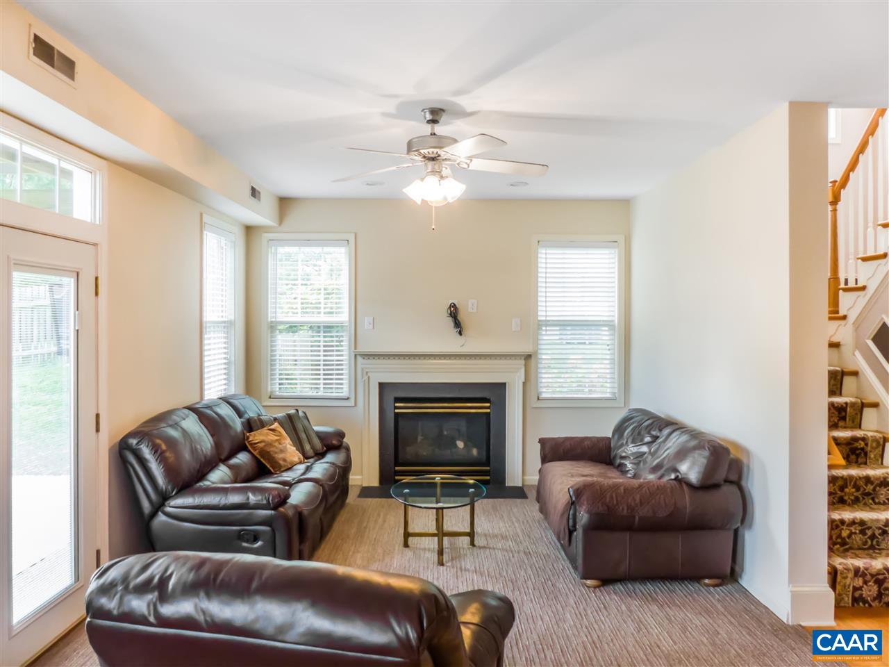 5372 Windy Ridge Road Charlottesville, VA 22903 - Photo 8 of 41 a living room with furniture and a fireplace