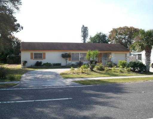 316 Center Road Venice, FL 34285 - Photo 1 of 1 a view of a house with a yard and plants