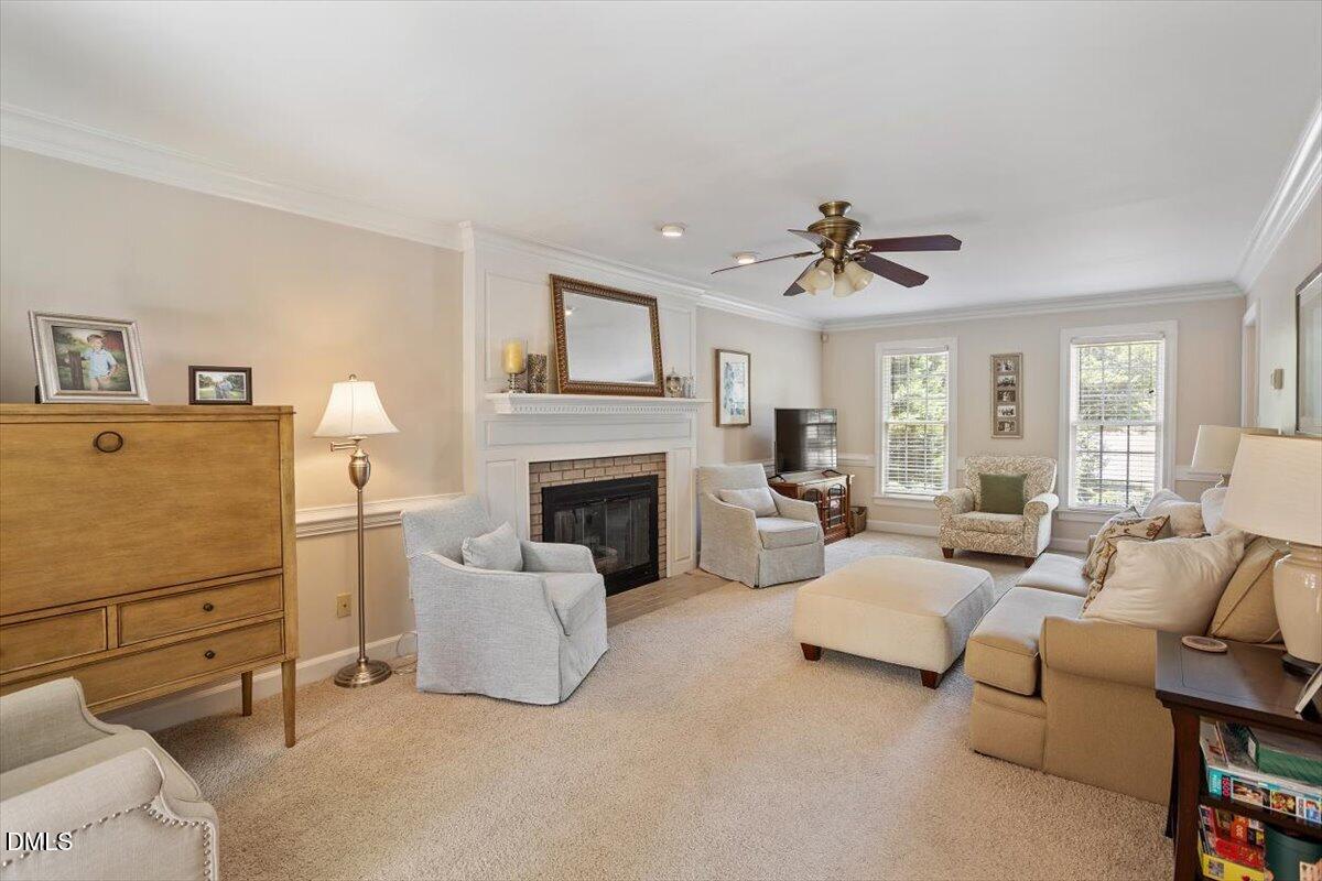 1808 Thorpshire Drive Raleigh, NC 27615 - Photo 4 of 17 a living room with furniture and a fireplace