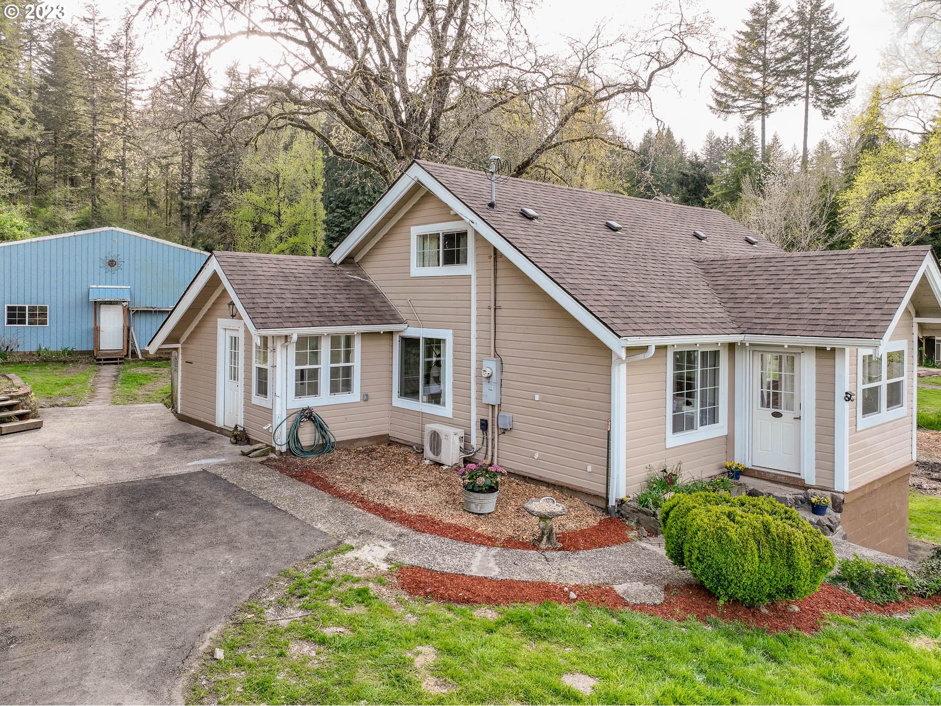 2075 Northeast Mossy Loop Toledo, OR 97391 - Photo 1 of 38 a view of a house with garden and trees