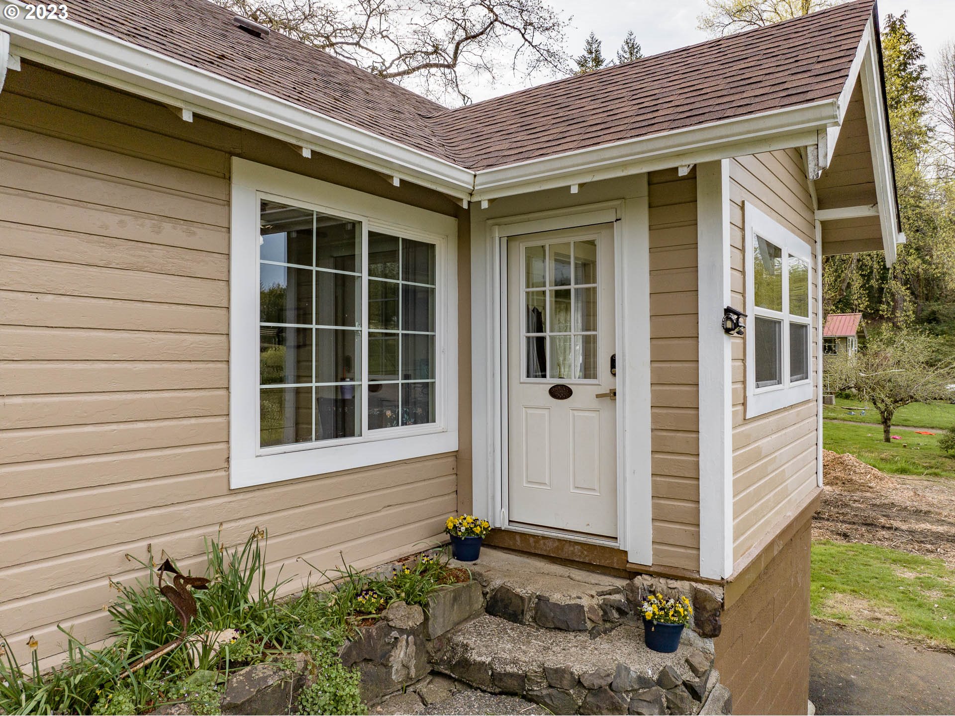 2075 Northeast Mossy Loop Toledo, OR 97391 - Photo 2 of 38 a front view of a house with a yard