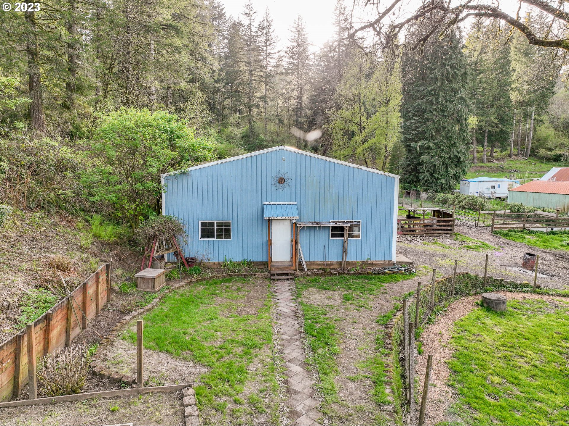 2075 Northeast Mossy Loop Toledo, OR 97391 - Photo 30 of 38 a house view with a garden space