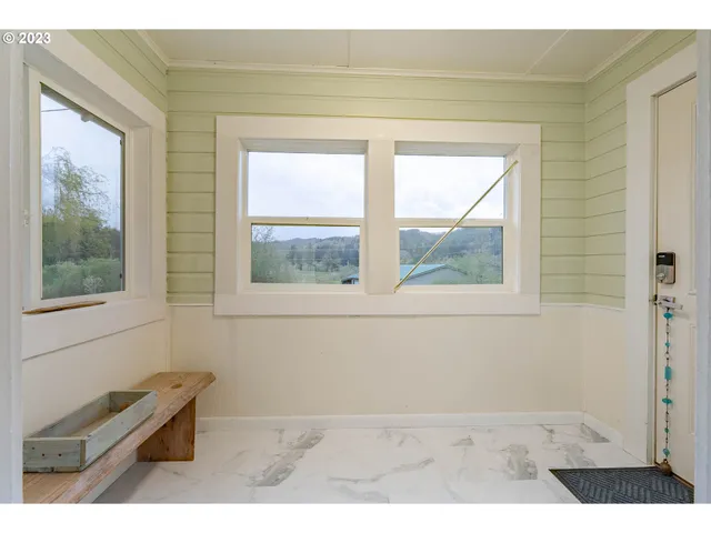 a view of an empty room and window