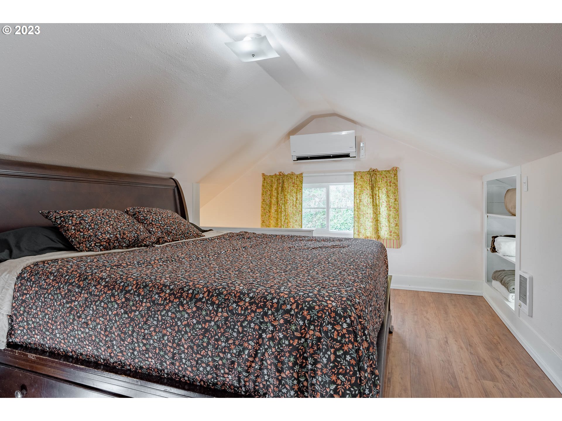 2075 Northeast Mossy Loop Toledo, OR 97391 - Photo 8 of 38 a bedroom with a bed and a window