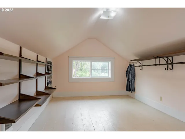 a view of entryway with stairs and wooden floor