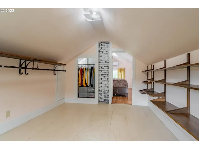a view of a livingroom with furniture and a ceiling fan
