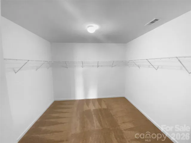 a view of a room with racks on the wall