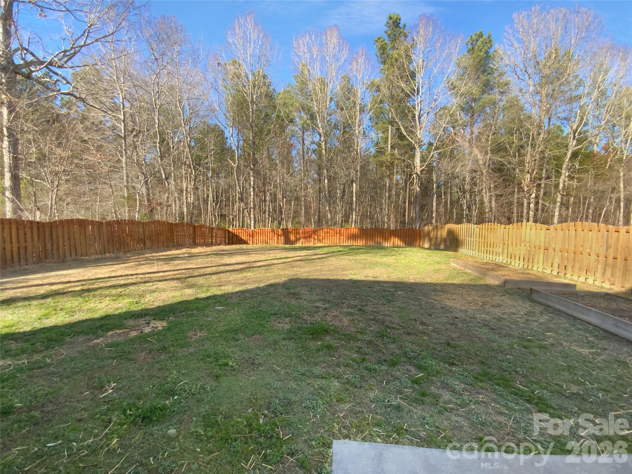 4115 Granite Street Midland, NC 28107 - Photo 20 of 25 a view of a swimming pool with a yard