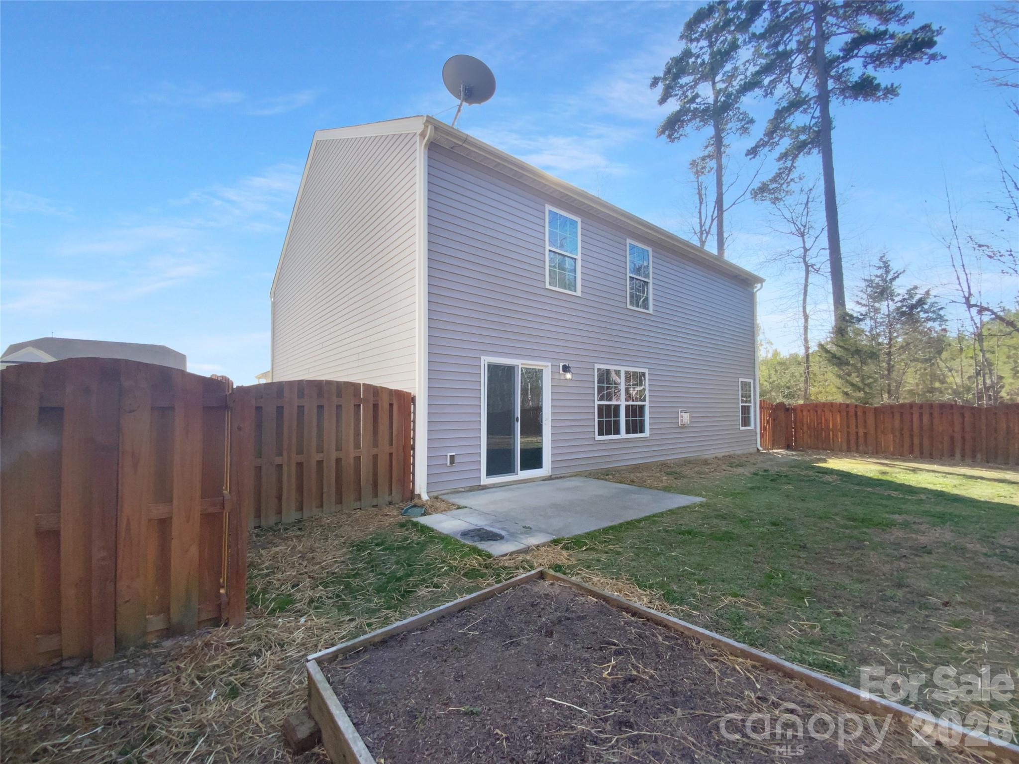 4115 Granite Street Midland, NC 28107 - Photo 21 of 25 a view of a house with backyard and trees