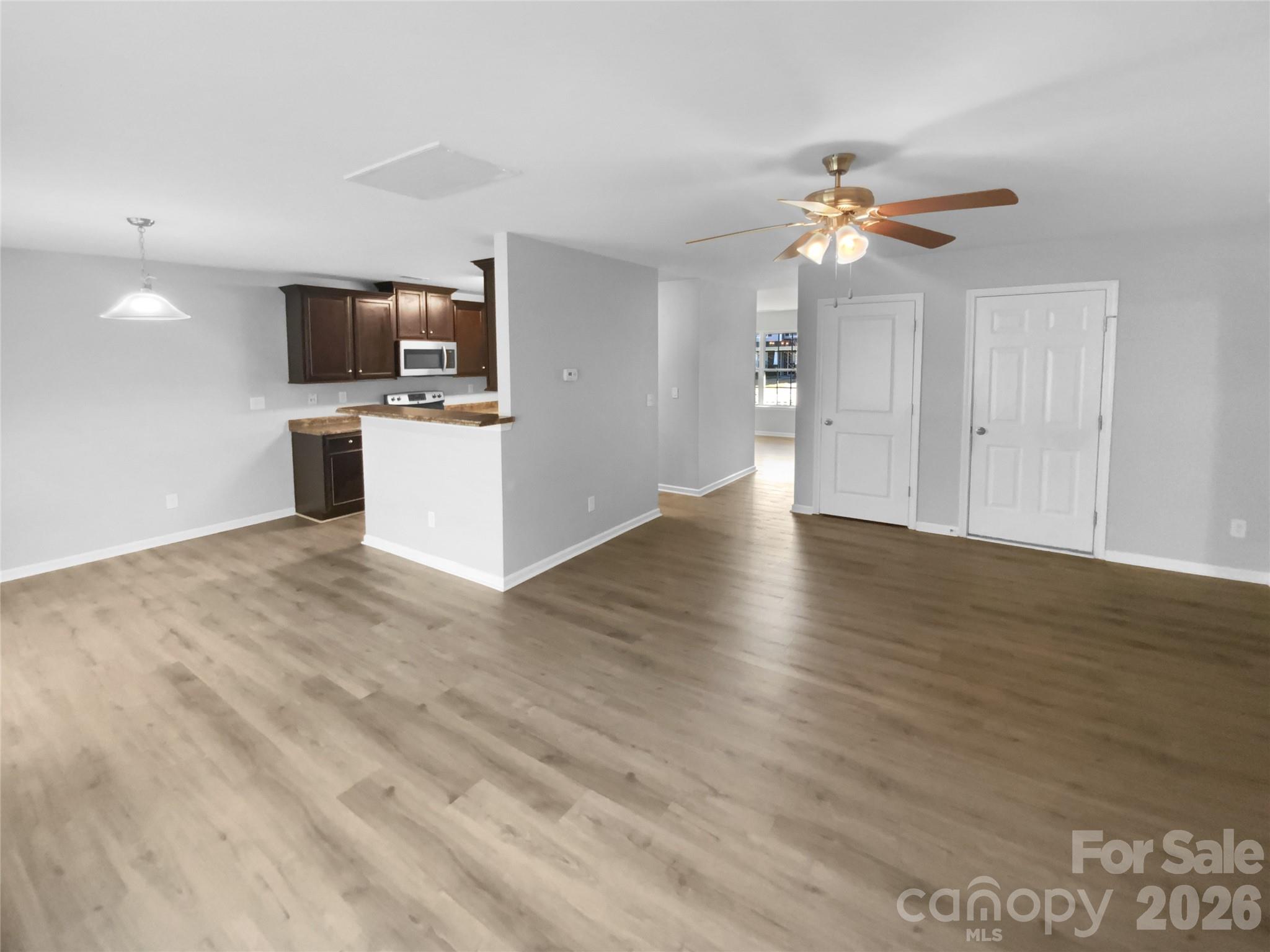 4115 Granite Street Midland, NC 28107 - Photo 7 of 25 a view of a kitchen with microwave and a sink