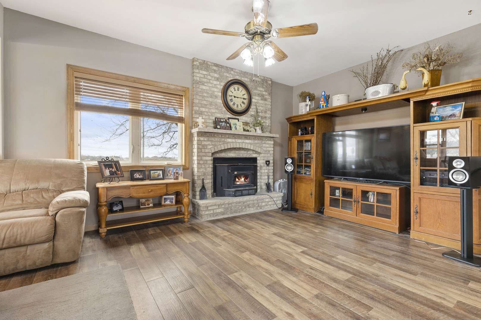 9407 Riley Road Marengo, IL 60152 - Photo 3 of 37 a living room with furniture a flat screen tv and a fireplace