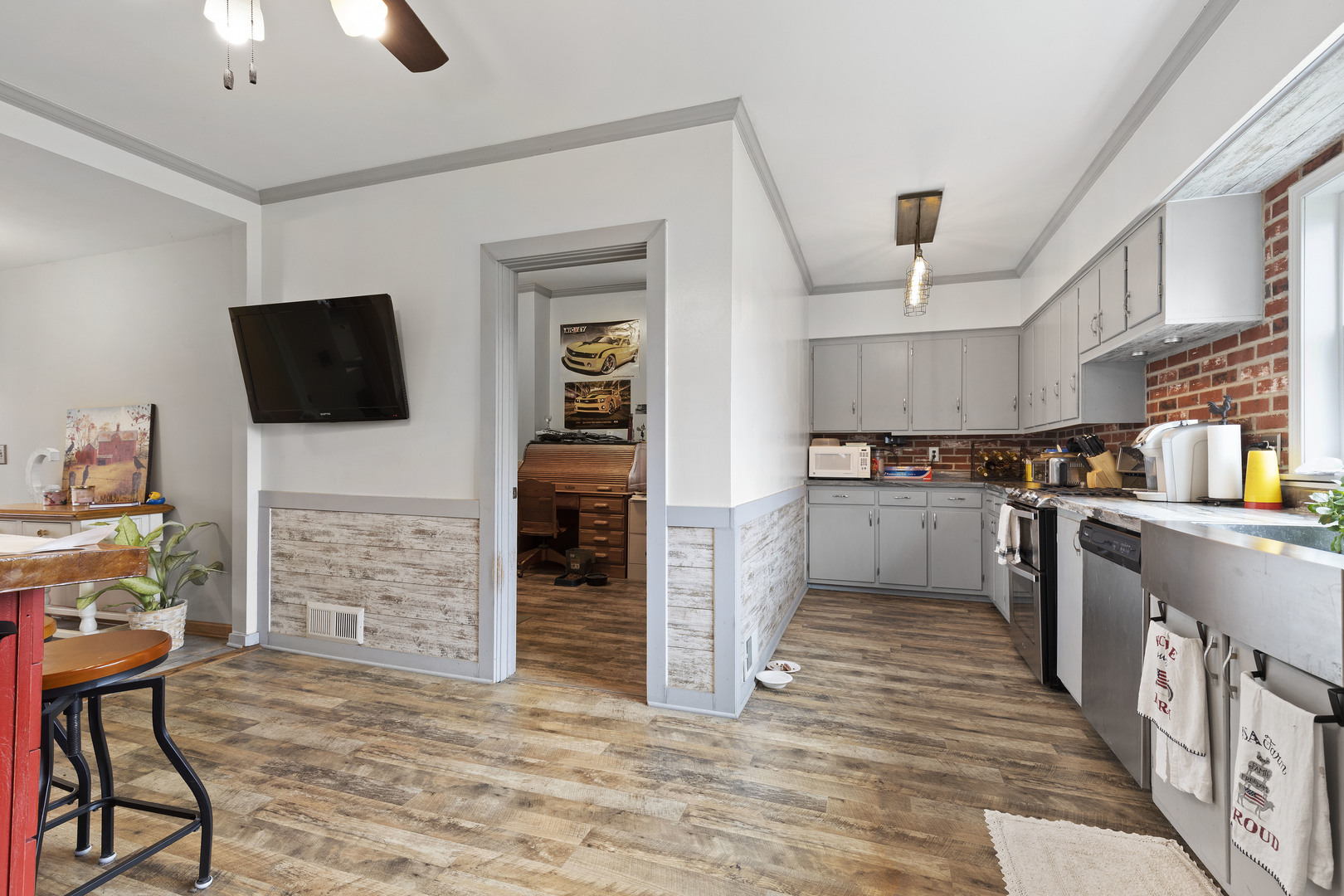 9407 Riley Road Marengo, IL 60152 - Photo 8 of 37 a kitchen with cabinets and wooden floor