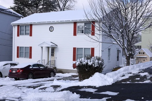 a view of a house with a yard