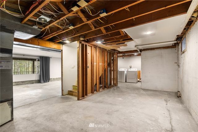 a view of empty room with wooden walls