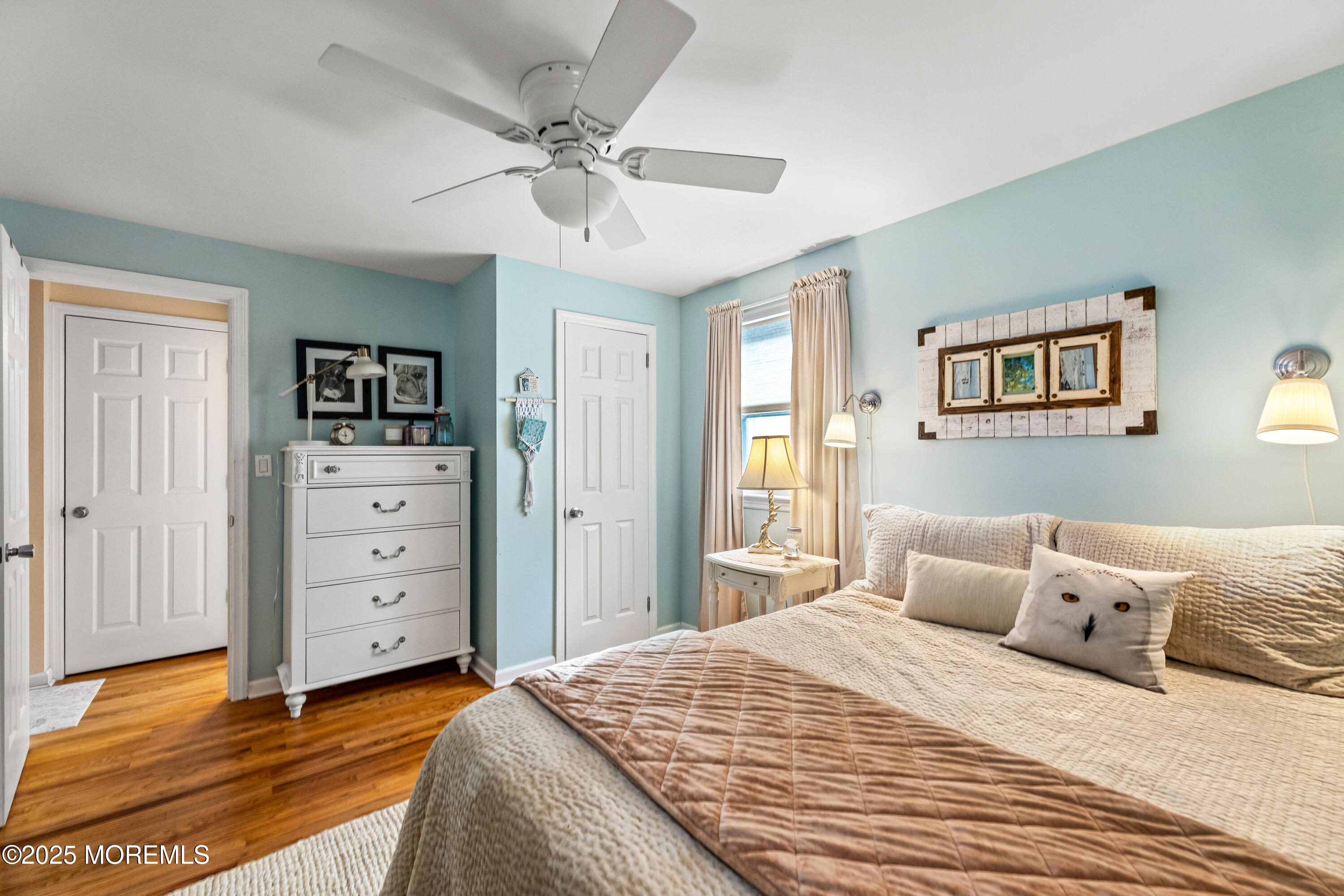 1609 Wight Street Wall, NJ 07719 - Photo 23 of 39 a bedroom with a bed and a chandelier