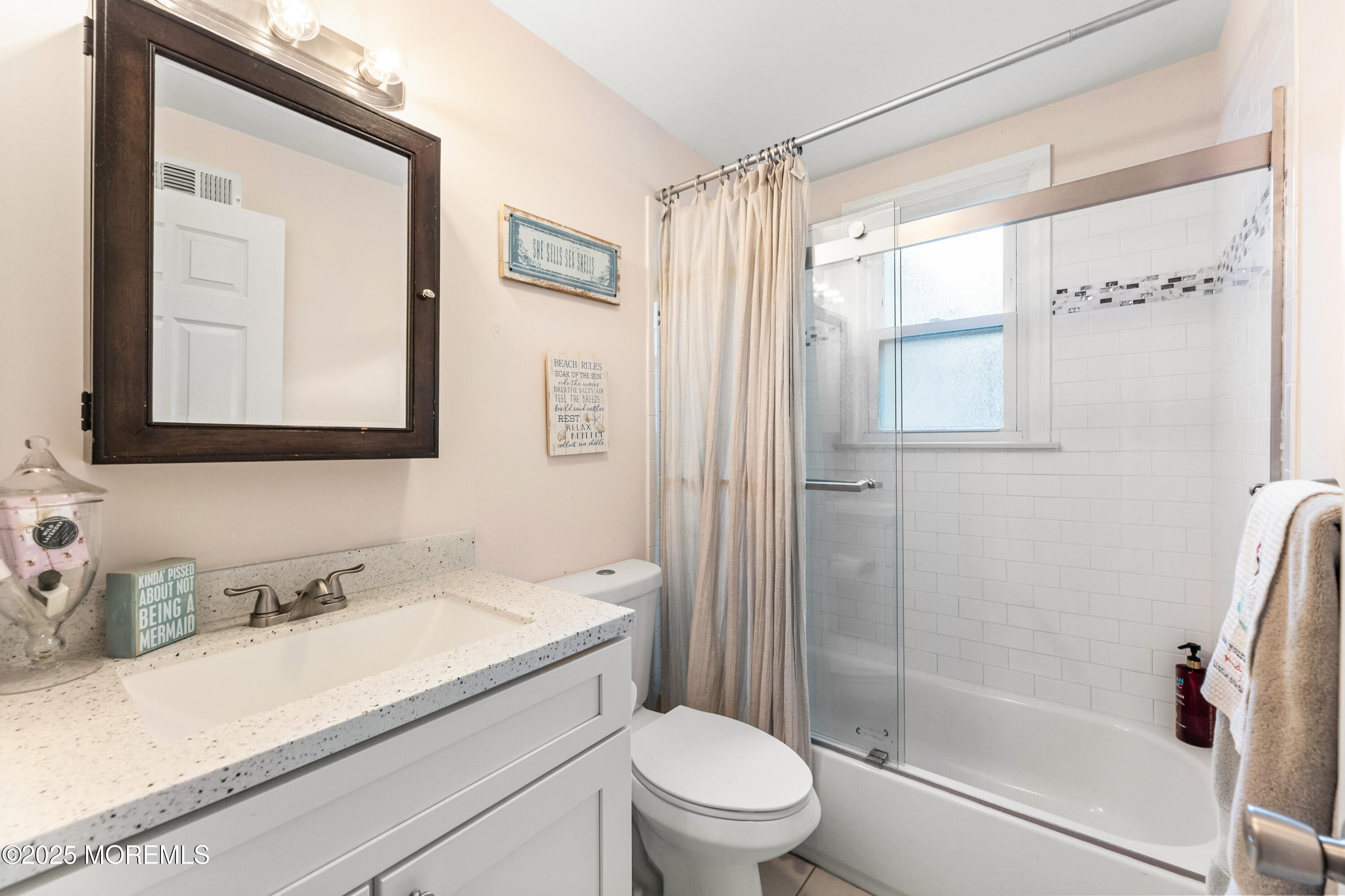 1609 Wight Street Wall, NJ 07719 - Photo 24 of 39 a bathroom with a granite countertop sink a toilet and shower