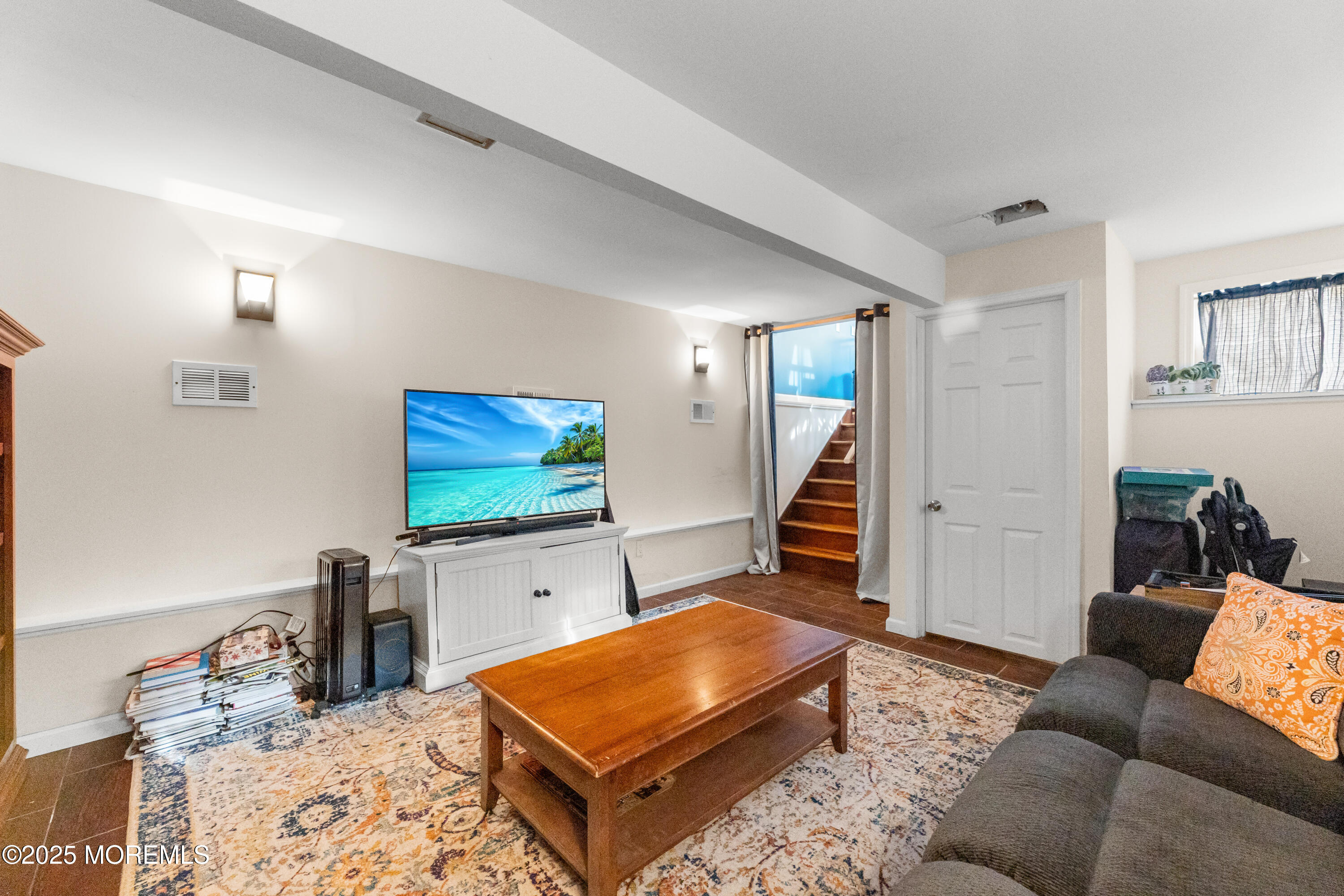 1609 Wight Street Wall, NJ 07719 - Photo 30 of 39 a living room with furniture and a flat screen tv