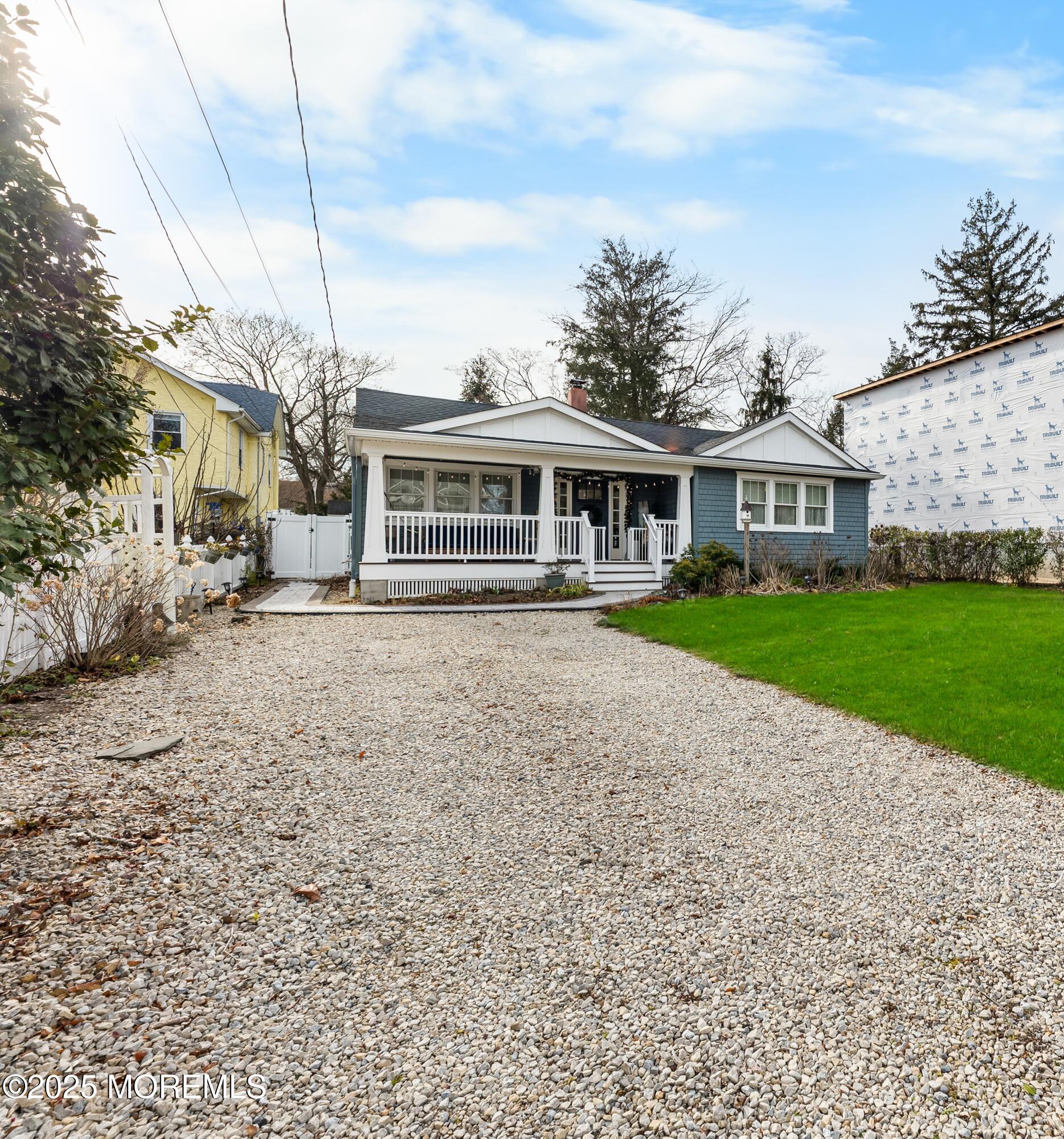 1609 Wight Street Wall, NJ 07719 - Photo 7 of 39 a view of a house next to a big yard with large trees